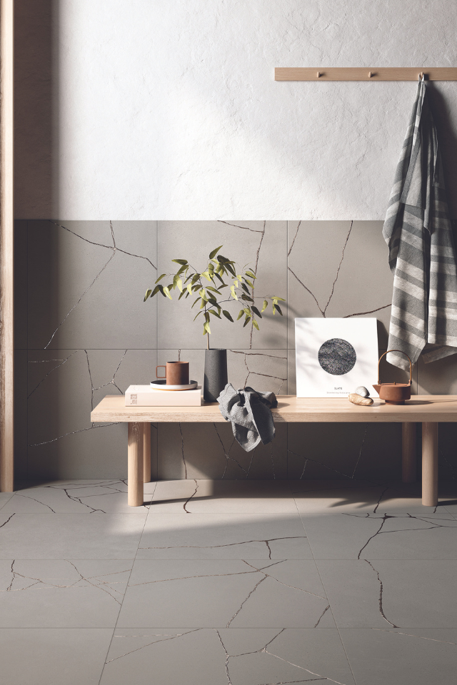 bathroom with natural-toned stone tile